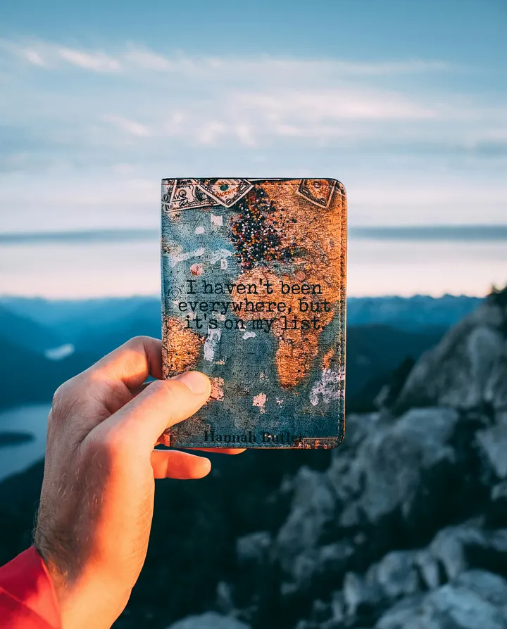 Vintage looking small notebook with mountain views in the background 