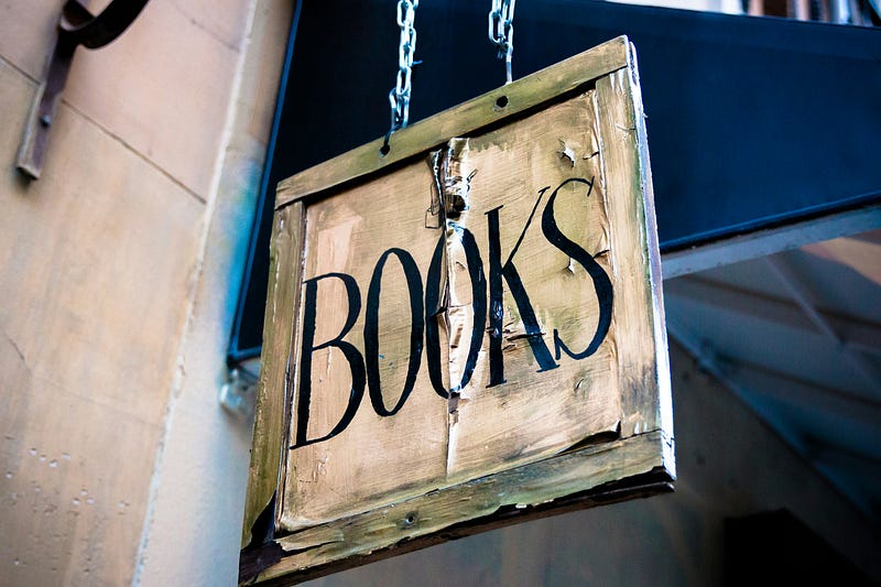 A sign that says Books on it