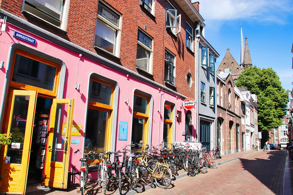 Store front with lots of bycicles parked outside signaling good business.