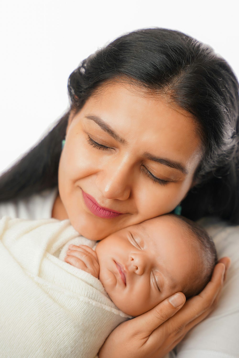 Woman holding a baby sleeping soundly