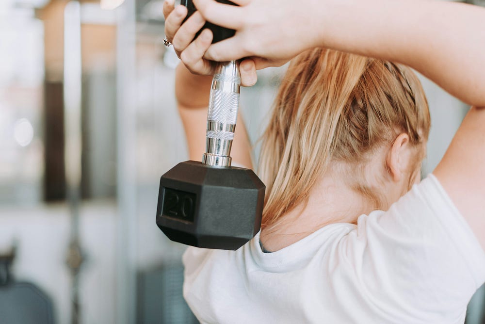 Woman working out with a dumbell