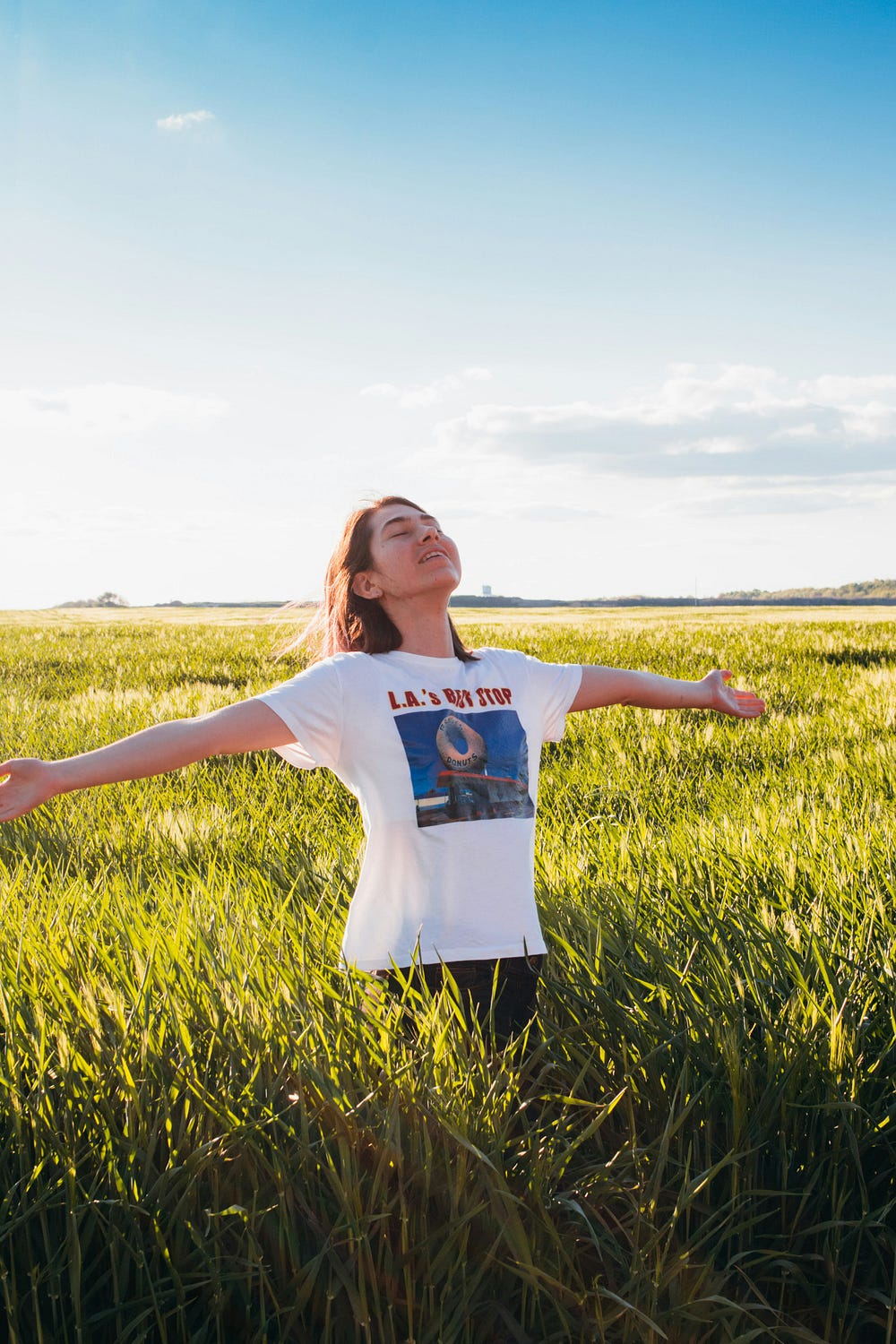 Woman enjoying the moment in an open field