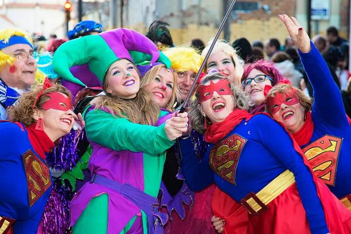 A bunch of people dressed up taking a picture.